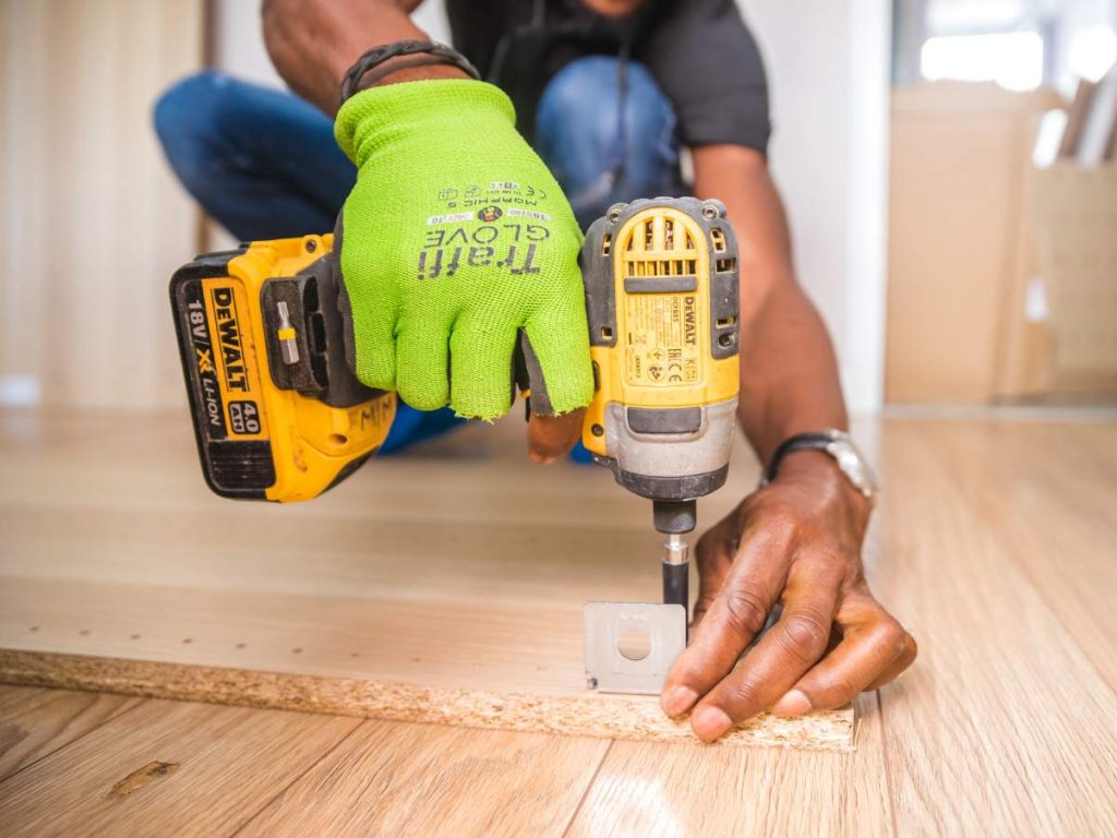 Handyman performing essential home repairs and maintenance tasks for Hailey's Pro Services