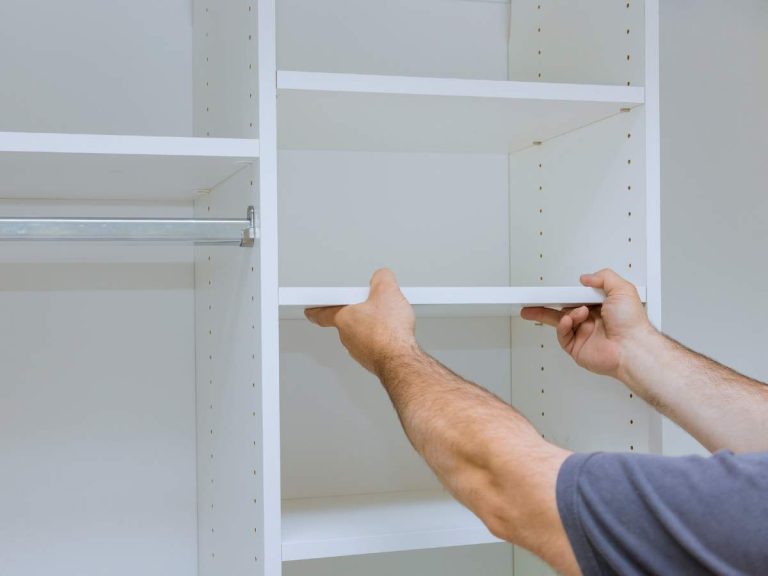 A handyman fixing a unique home feature like a customized shelving unit