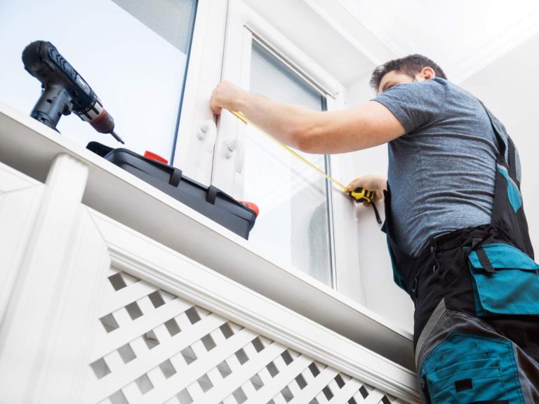 A handyman from Hailey's Pro Services working on a specialized home project