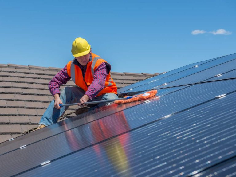 A handyman performing unique tasks specific to California, such as earthquake-proofing and solar panel maintenance