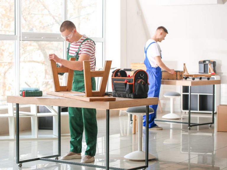 A handyman holding tools and a contractor reviewing building plans, highlighting their different roles in home improvement