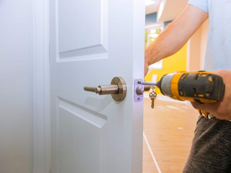 A homeowner performing an easy home repair, such as fixing a leaky faucet or replacing a door hinge, with simple DIY tools.