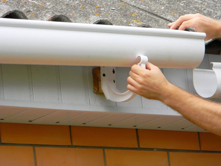 Various types of gutters for homes, including aluminum and seamless options, installed on modern and traditional homes.